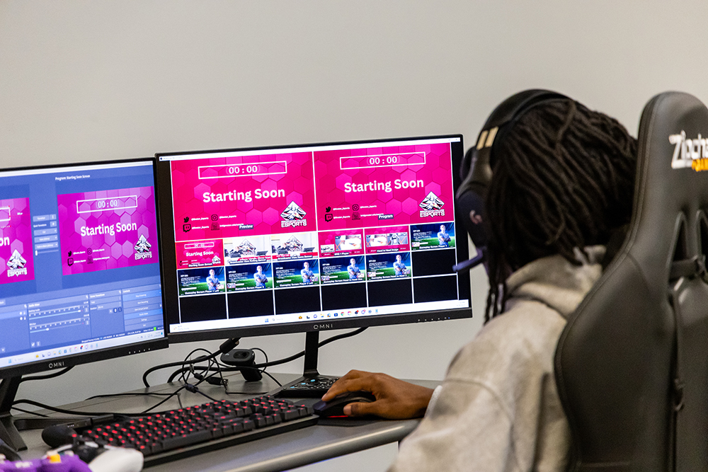 Esports players waiting for watch to start as the computer screens show the match starting soon