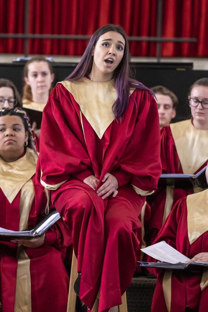 Sara Henneberger singing in the choir