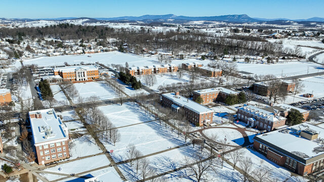 Campus drone photo with campus covered in snow