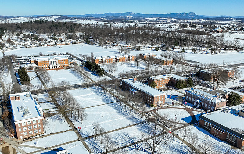 Campus drone photo with campus covered in snow