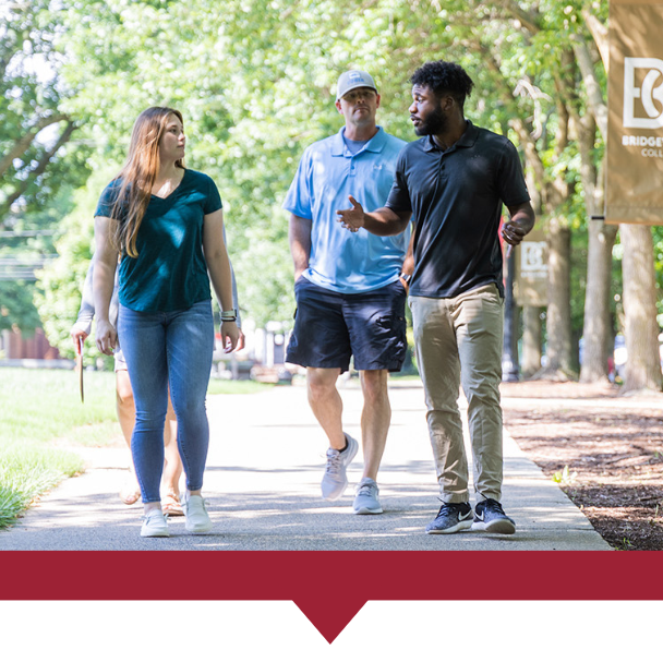 Prospective family being led on a tour during the spring