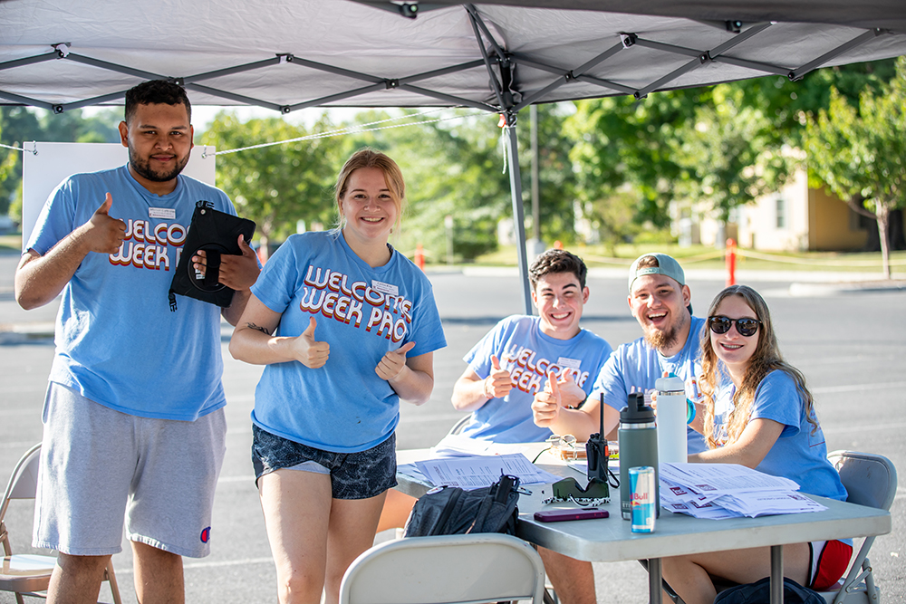 Five students wearing blue welcome week pro t-shirts