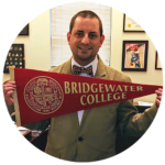 Chris Obenshain holding up Bridgewater College pennant flag