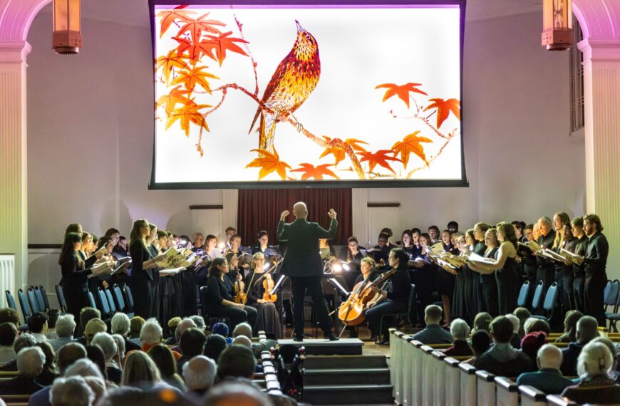 Dr. Ryan Keebaugh directs students and other members of the BC community during a performance of Christopher Tin's "The Lost Birds" in Nov. 2023.