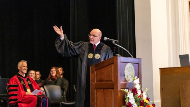 The Rev. Wil Nolen gestures while delivering his address
