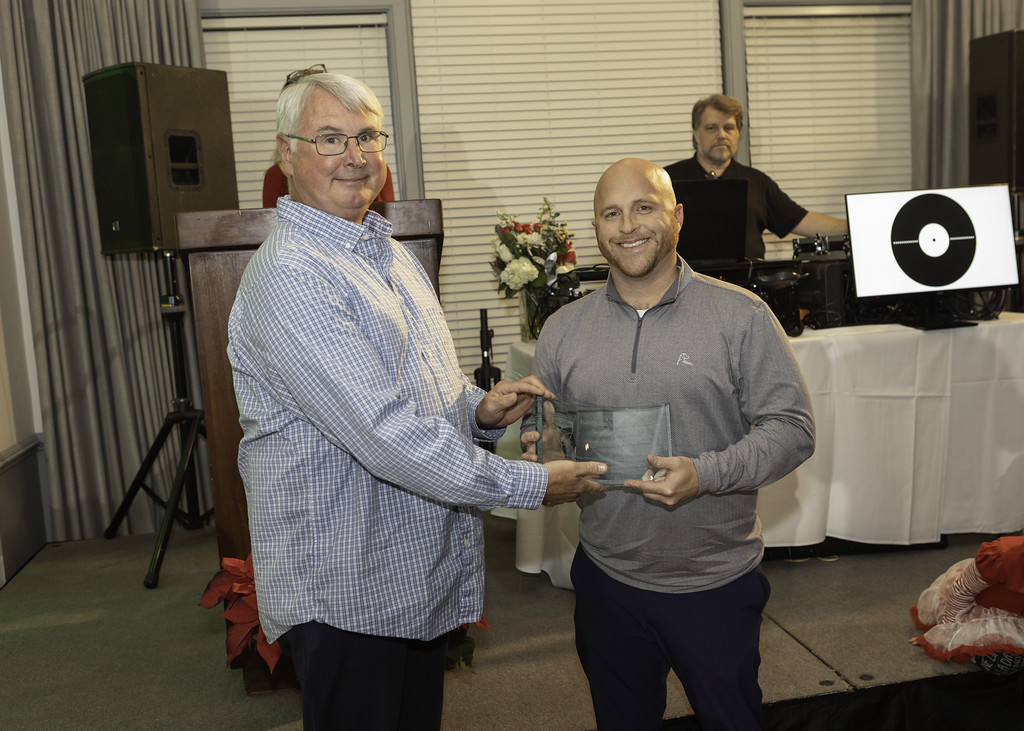 Lance Smith, a sergeant at the Albemarle County Police Department, received the 2023 Steve Sellers Leadership Award from the award's namesake and former police chief.