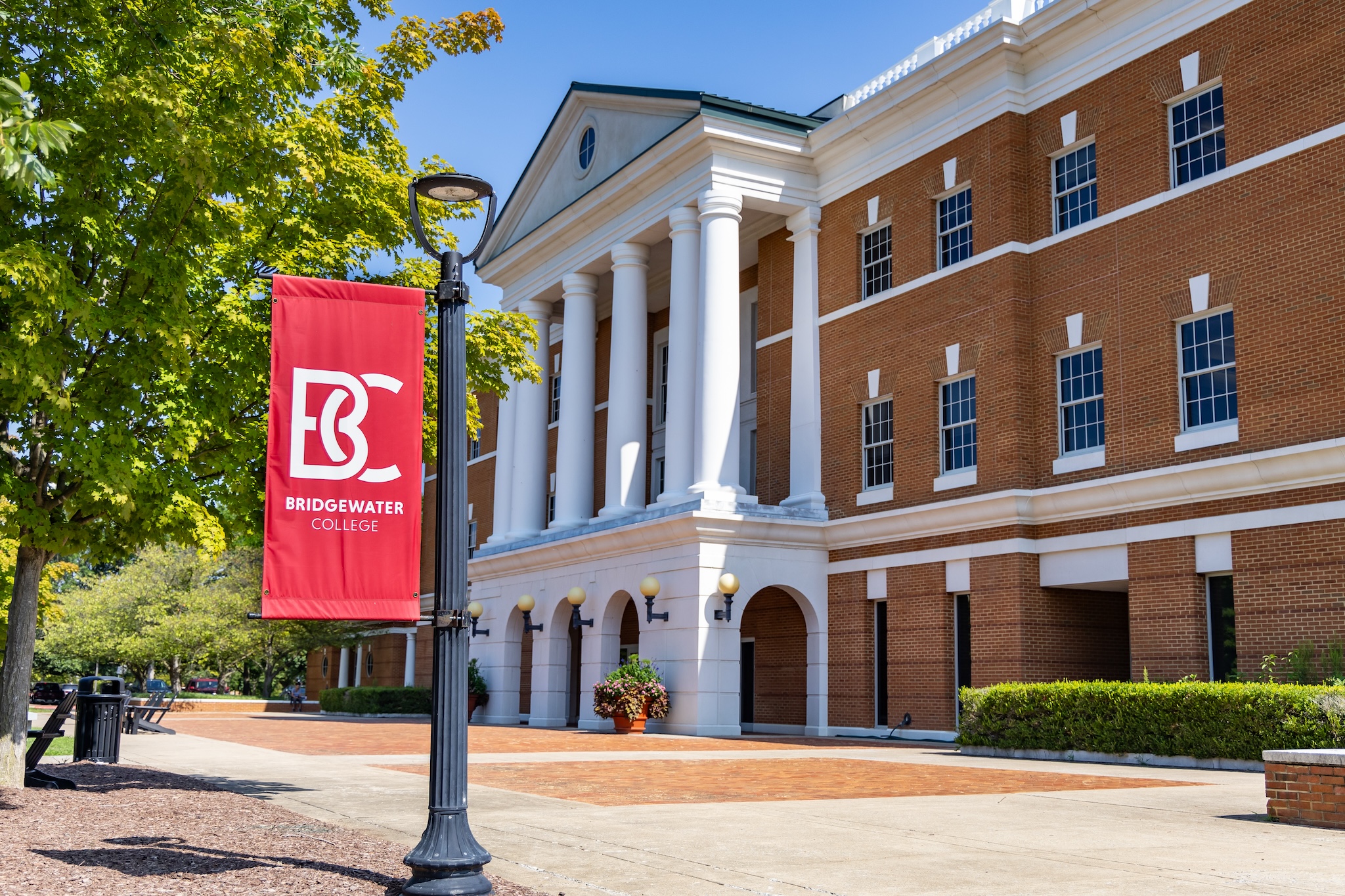 McKinney building in the background with B-C banner on a light post in the foreground