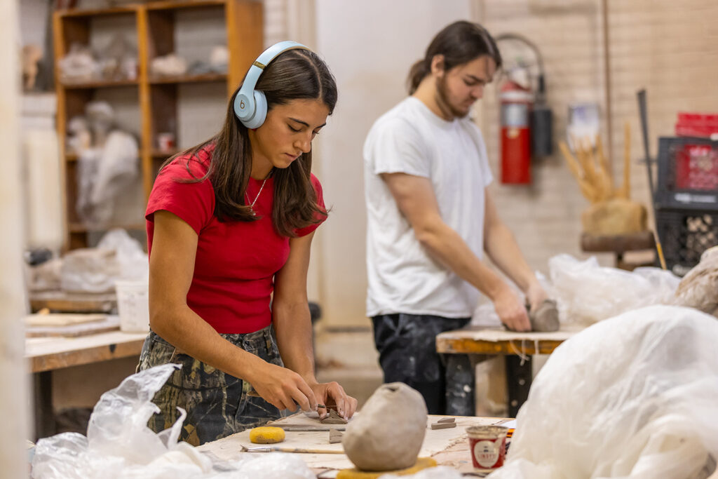 Students working with ceramics