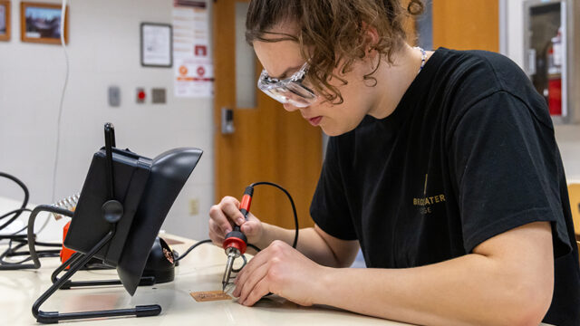 Engineering student working in an engineering lab