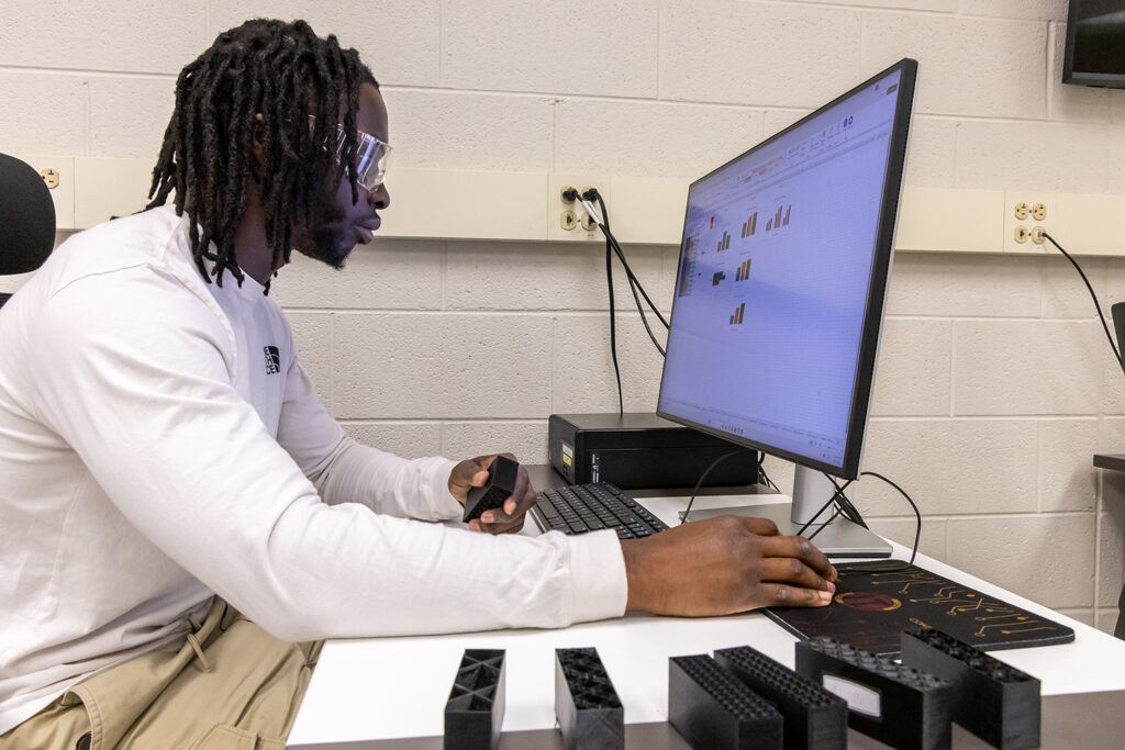 Student working on computer in design lab