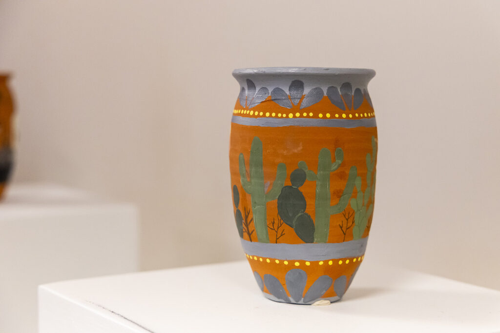 Pottery painted with cactus on display
