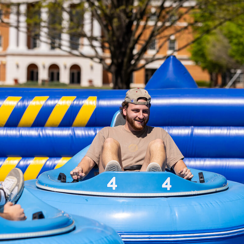Bridgewater College student in inflatable bumber car