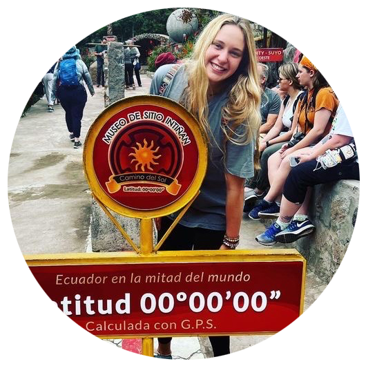 Student in front of latitude sign on study abroad trip