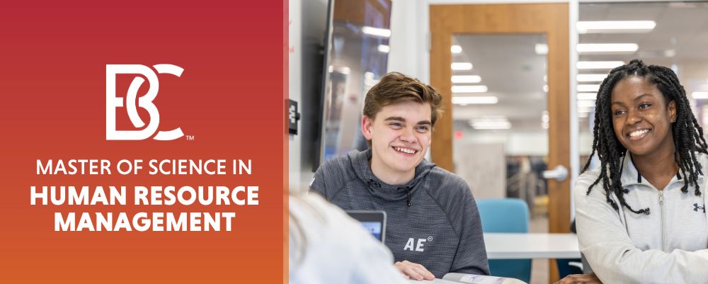 Master of Science in Human Resource Management in white text on orange gradient Two students smiling in class on the right 