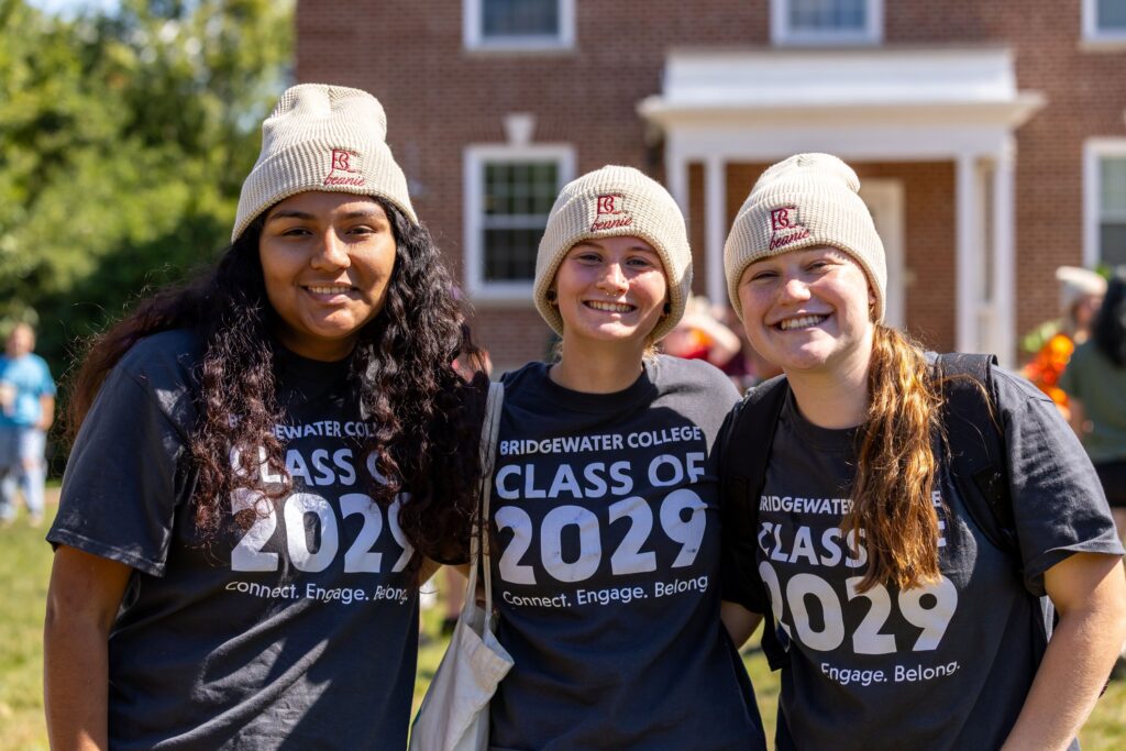 Three new students in Class of 2029 wearing BC Beanies