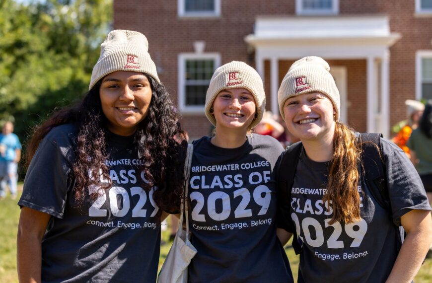 Three new students in Class of 2029 wearing BC Beanies