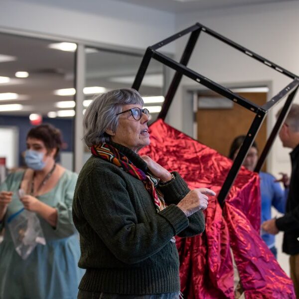 Professor Nan Covert at an art gallery opening.