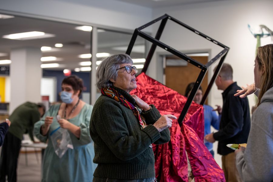 Professor Nan Covert at an art gallery opening.