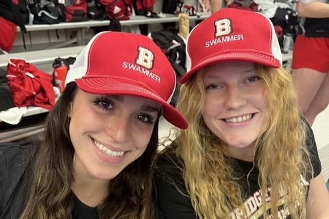 Two girls wearing Swamily hats with a bridgewater B