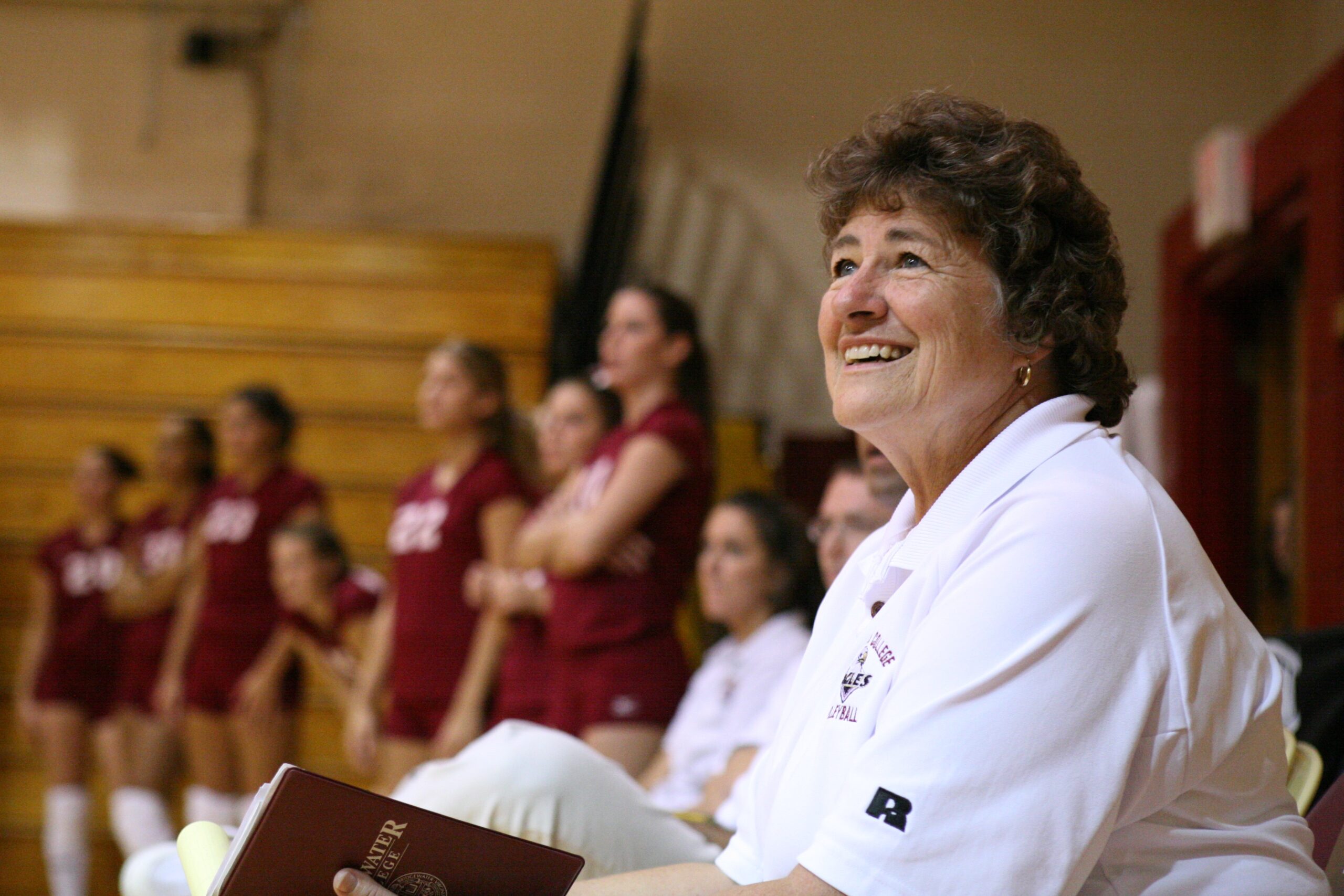 Mary Frances Heishman coaches a volleyball game and looks inspired