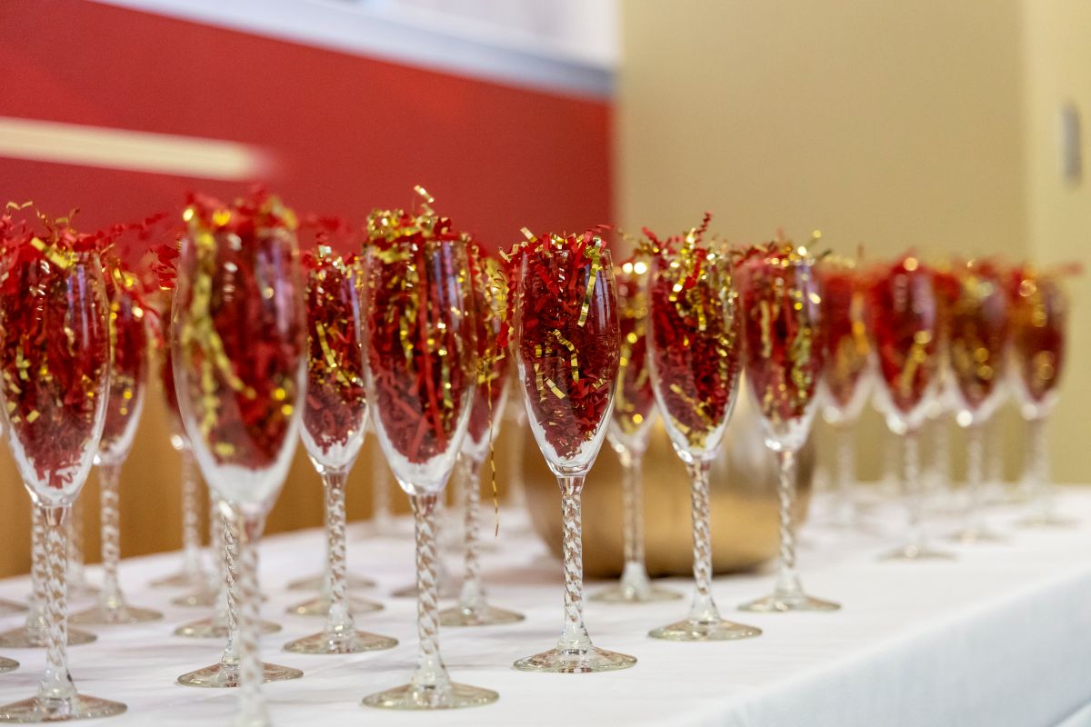 row of Chapagne flutes filled with confetti