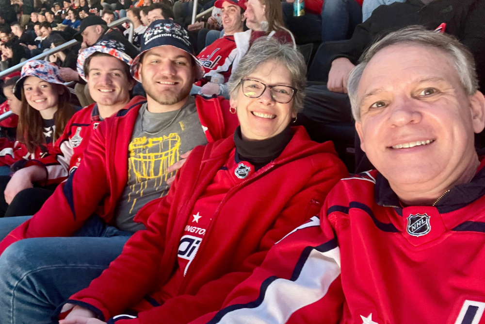 A Famil of Bridgewater Alumni sit at a capitals hockey game