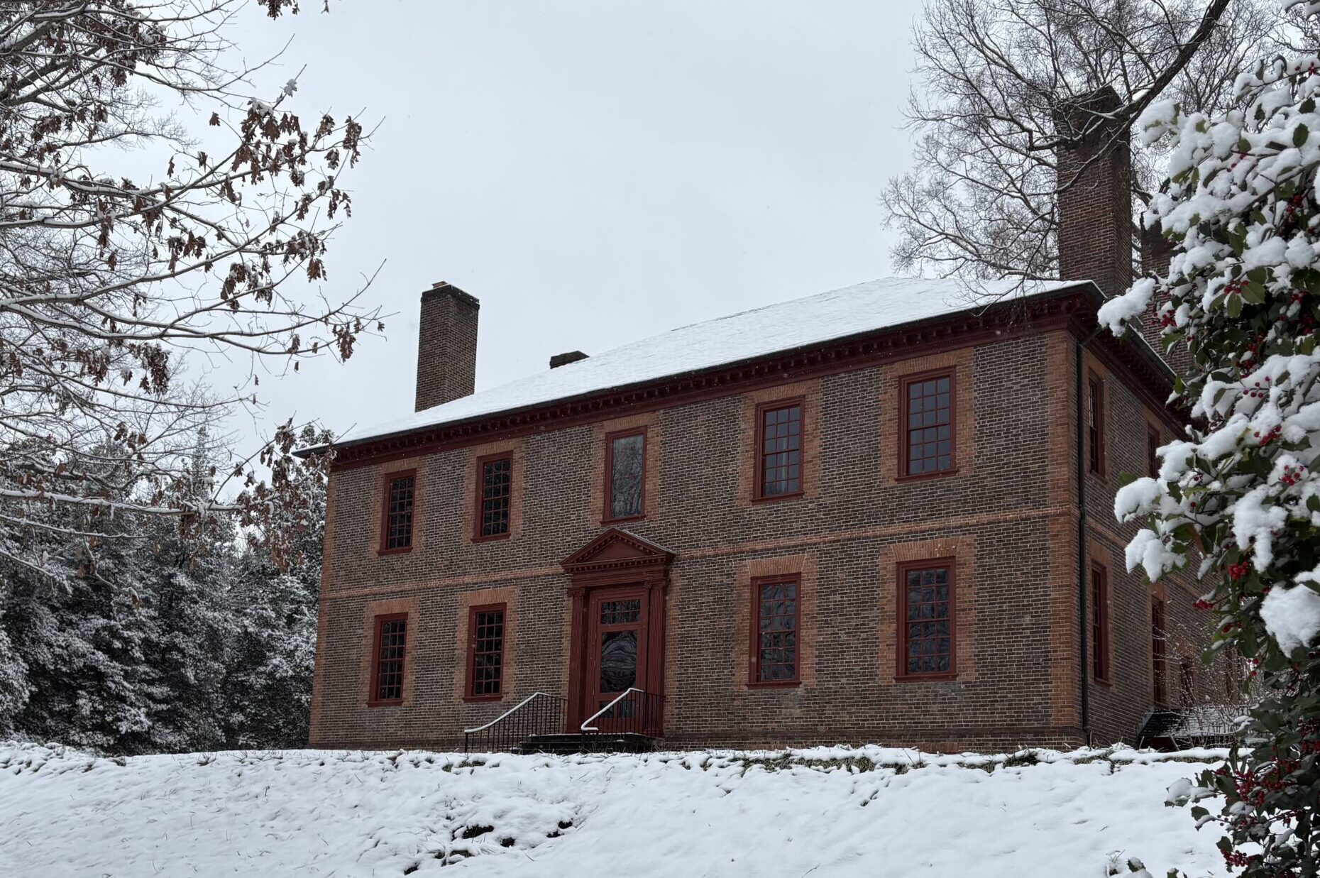 Wilton House covered in snow atop a hill