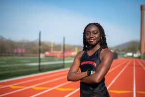 Adalia Coleman stands confidently in her track uniform